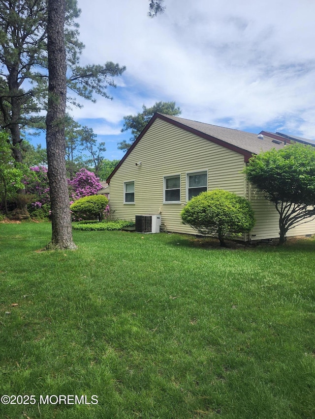 33 Penwood Dr Unit 55, Whiting, NJ 08759 - view of side of home with a lawn and central AC unit