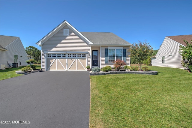 view of front facade featuring a garage, a front yard, central AC, and driveway