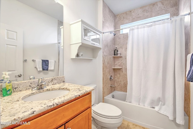 bathroom featuring shower / tub combo, vanity, and toilet