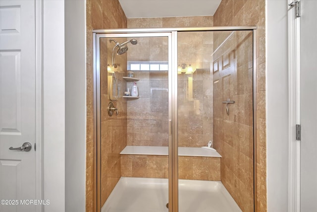 bathroom featuring a shower stall