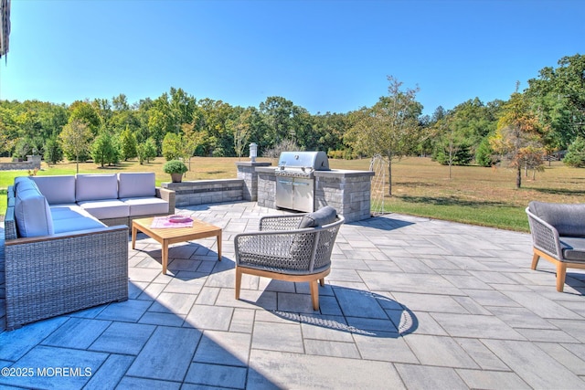 view of patio featuring grilling area, area for grilling, and an outdoor hangout area