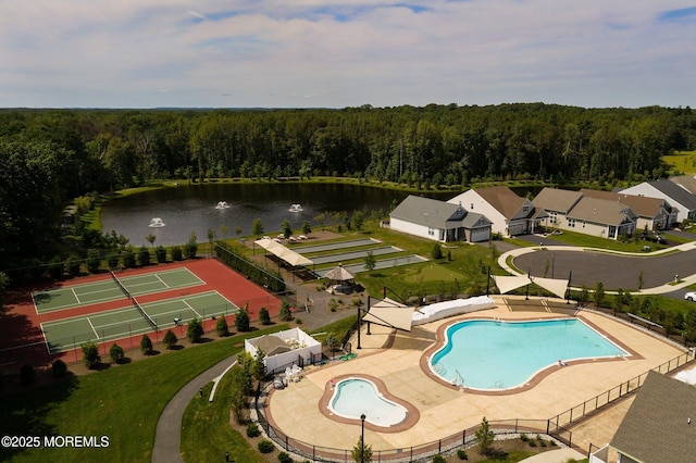 bird's eye view featuring a forest view and a water view