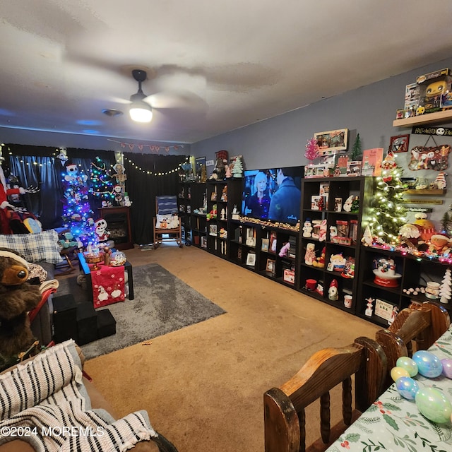 interior space with ceiling fan