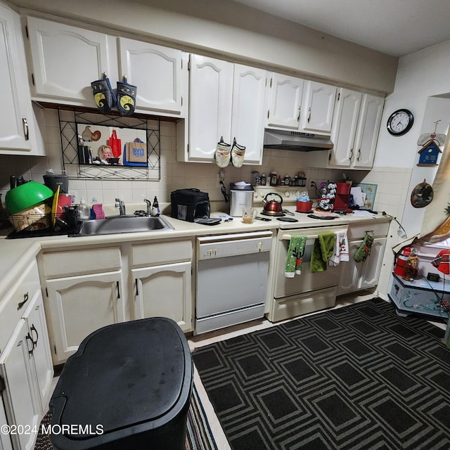 kitchen featuring backsplash, white appliances, and white cabinets