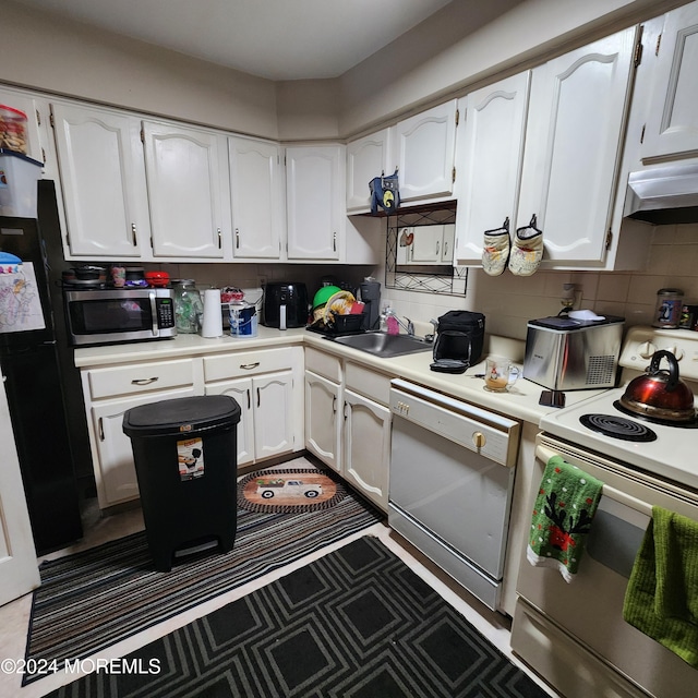 kitchen with sink, dishwasher, white electric stove, and white cabinetry