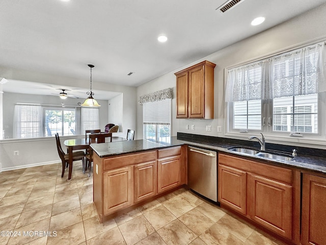 kitchen featuring ceiling fan, sink, a healthy amount of sunlight, stainless steel dishwasher, and kitchen peninsula