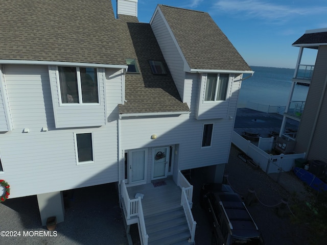 rear view of house with a water view