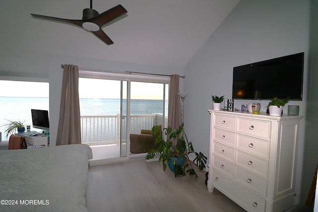 bedroom featuring lofted ceiling, light wood finished floors, and ceiling fan