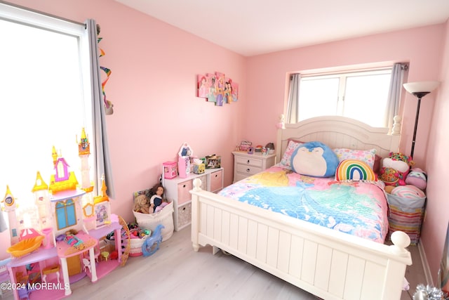 bedroom with wood finished floors