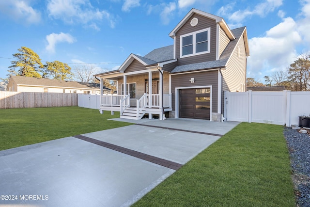 view of front of property with a front lawn, a porch, and a garage