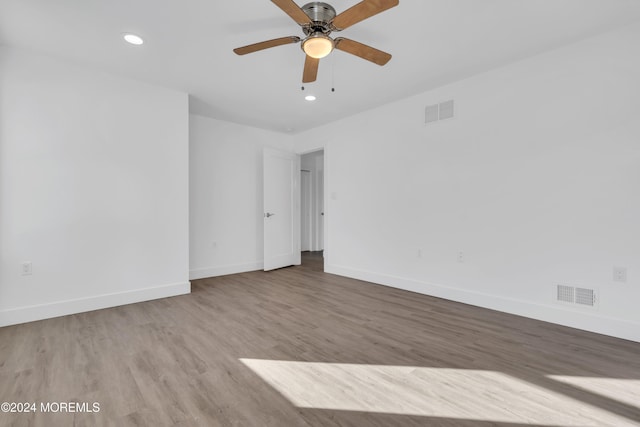 unfurnished room featuring ceiling fan and hardwood / wood-style flooring