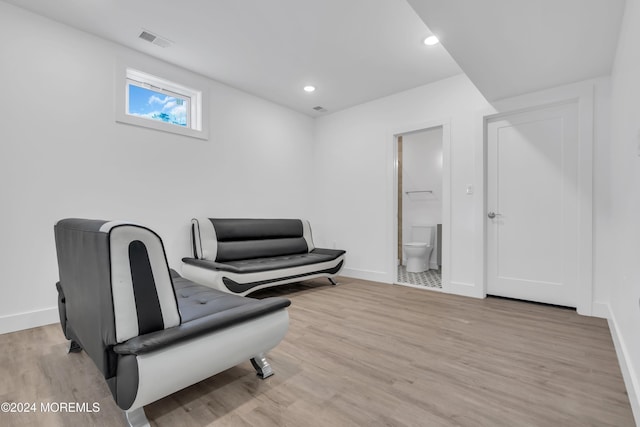 sitting room with light hardwood / wood-style flooring