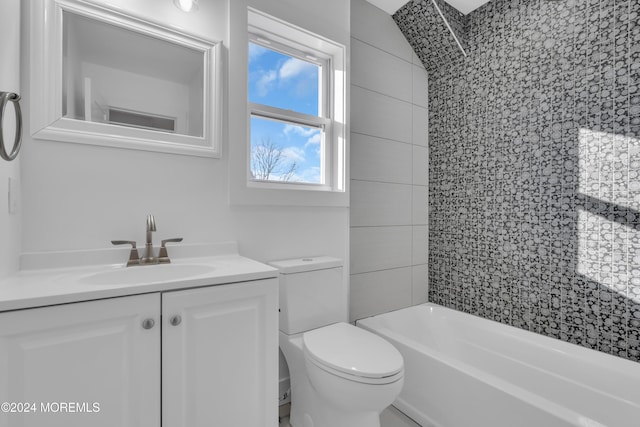 full bathroom featuring vanity, toilet, and tiled shower / bath