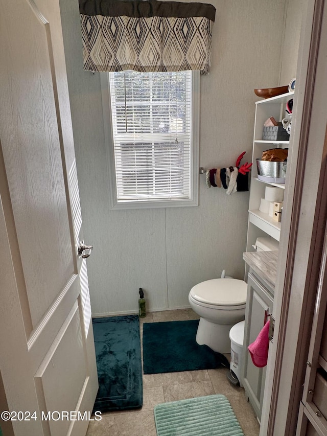 bathroom with tile patterned floors and toilet