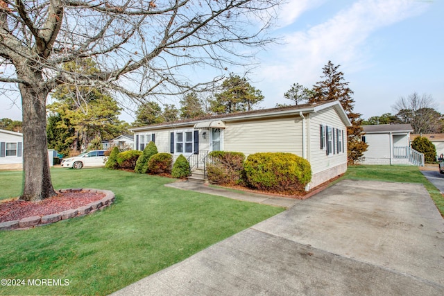 view of front of home with a front yard