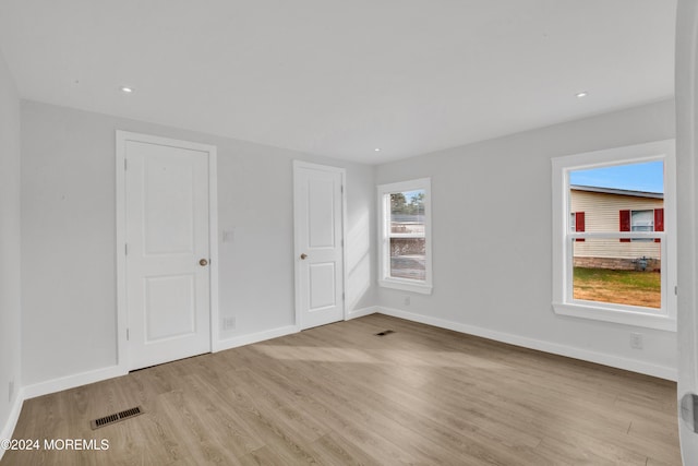 unfurnished bedroom featuring light hardwood / wood-style floors