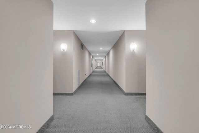 hallway featuring carpet flooring