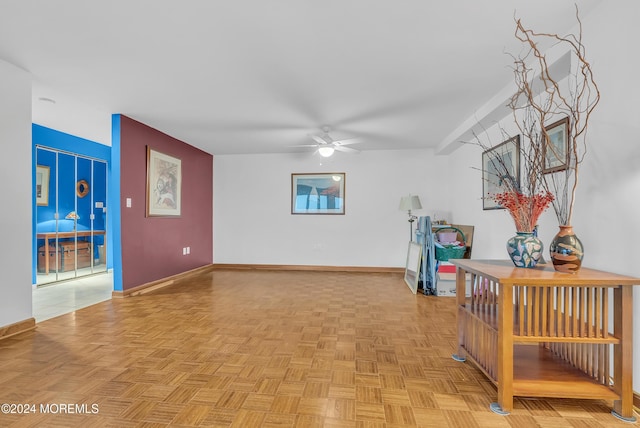 interior space with ceiling fan and light parquet flooring