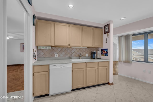 kitchen featuring ceiling fan, sink, light brown cabinets, tasteful backsplash, and white dishwasher