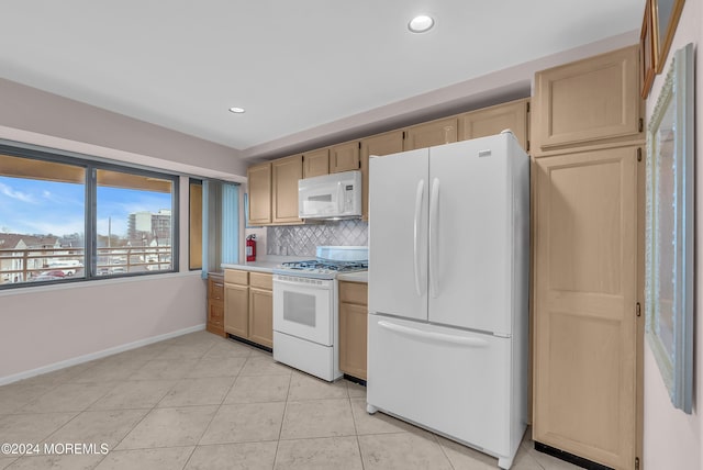 kitchen with backsplash, light brown cabinetry, light tile patterned floors, and white appliances