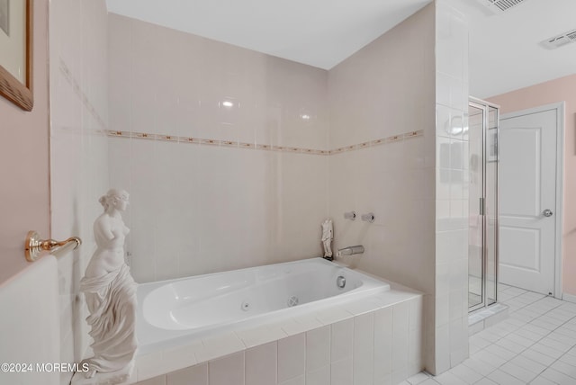 bathroom featuring plus walk in shower and tile patterned floors