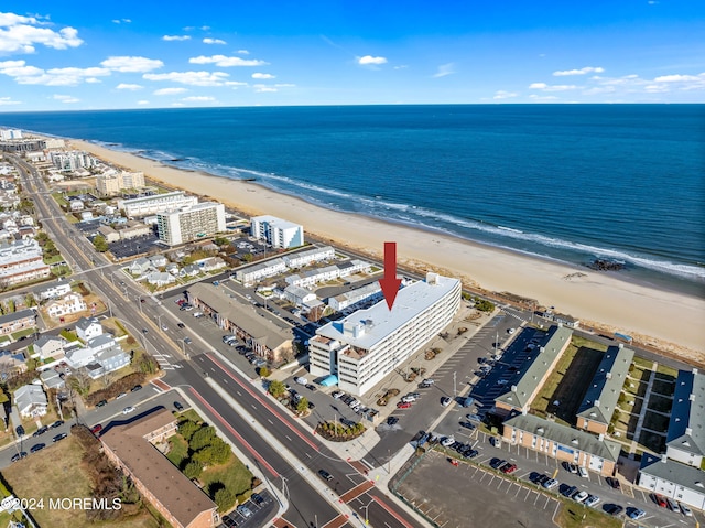 drone / aerial view with a view of the beach and a water view