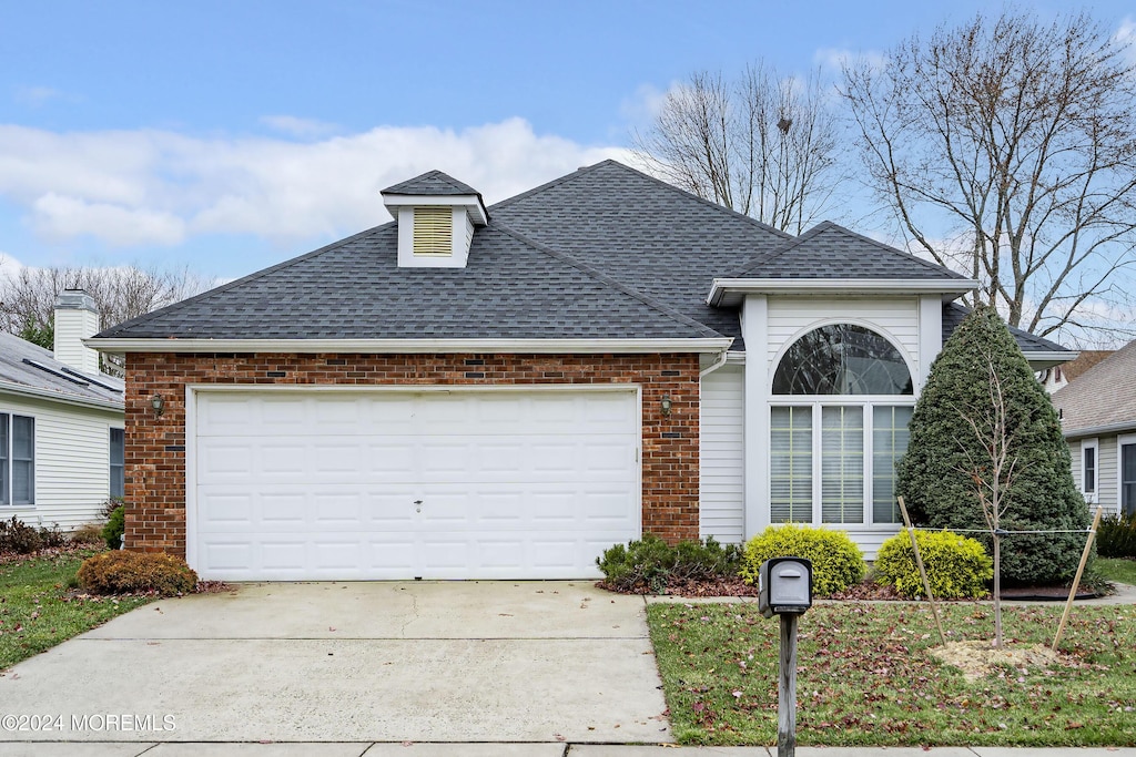 view of front of home with a garage