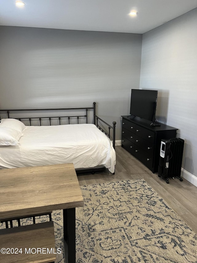 bedroom featuring hardwood / wood-style flooring