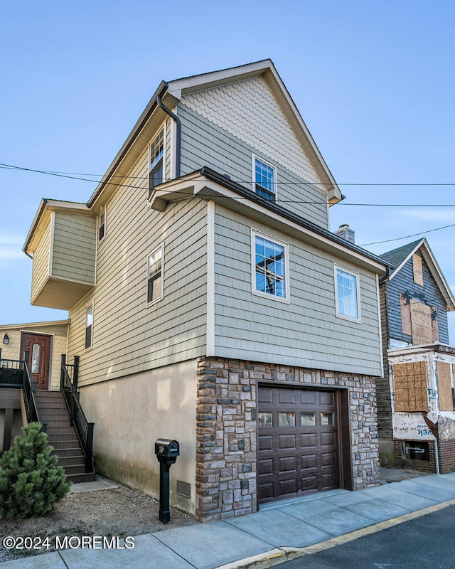 view of property exterior with a garage