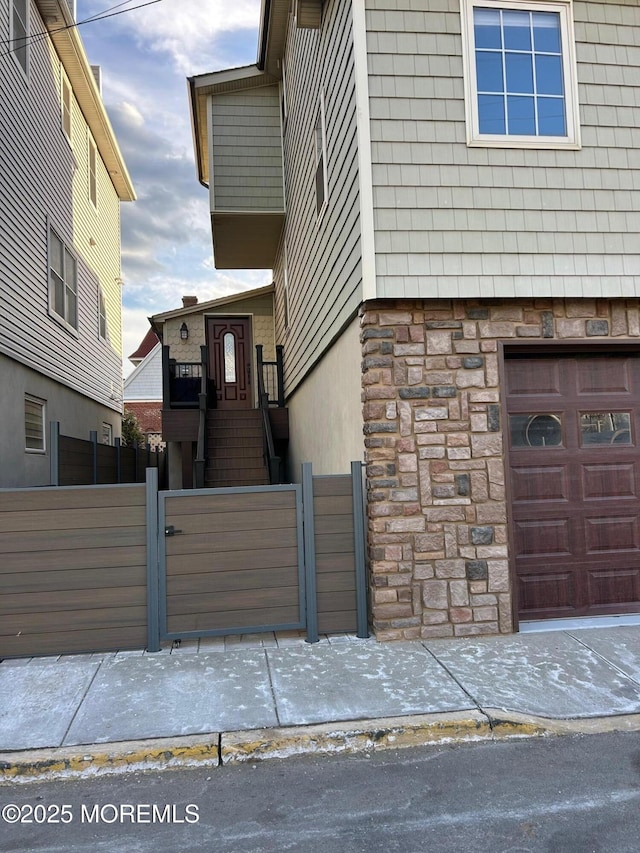 view of side of home with a garage