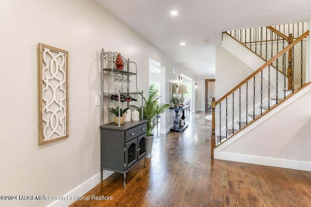 foyer entrance with dark hardwood / wood-style floors