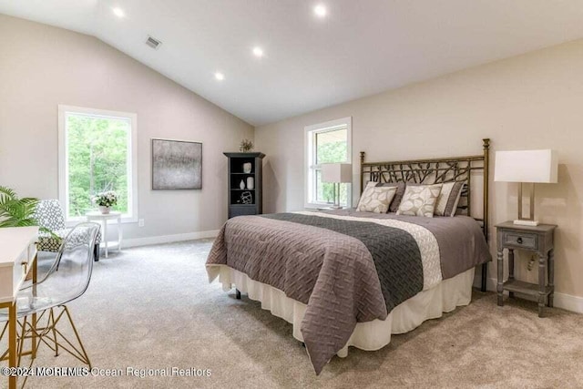 carpeted bedroom featuring lofted ceiling