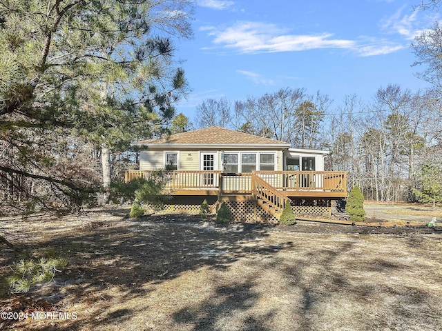 back of property featuring a deck