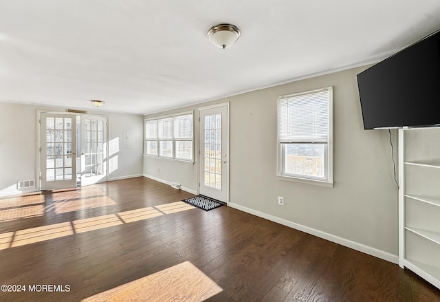 interior space with french doors and dark hardwood / wood-style floors