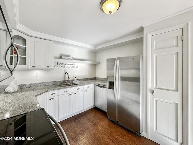 kitchen featuring dark wood-type flooring, white cabinets, sink, appliances with stainless steel finishes, and light stone counters