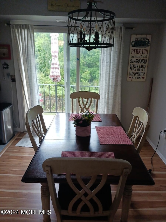 dining area featuring wood-type flooring