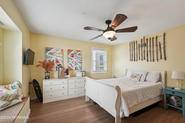 bedroom featuring dark hardwood / wood-style flooring and ceiling fan