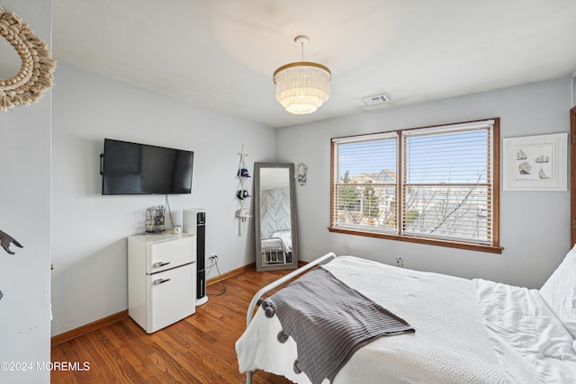 bedroom with wood-type flooring