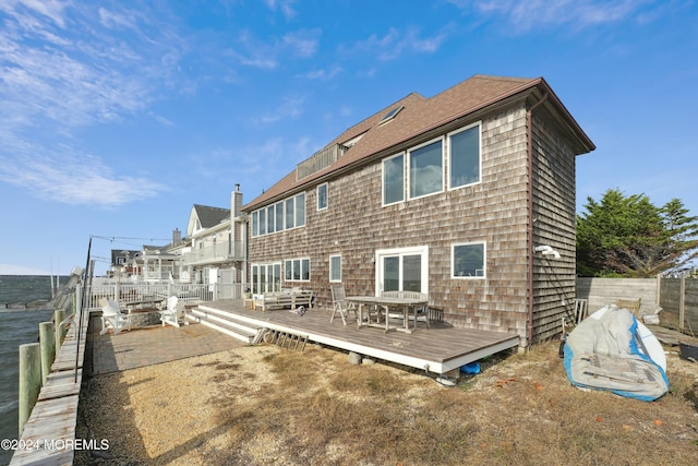 back of house featuring a deck