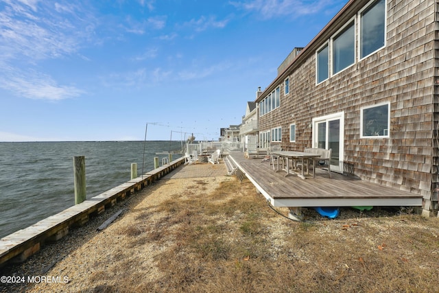 dock area featuring a deck with water view