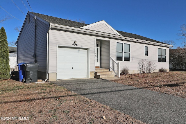 single story home with a garage