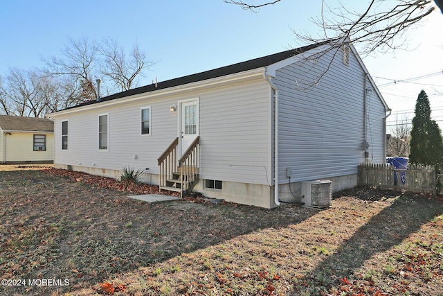 rear view of property with central air condition unit