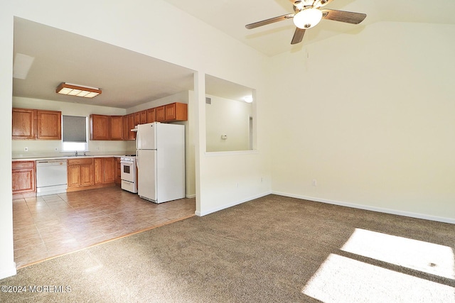 kitchen with light carpet, white appliances, ceiling fan, and sink