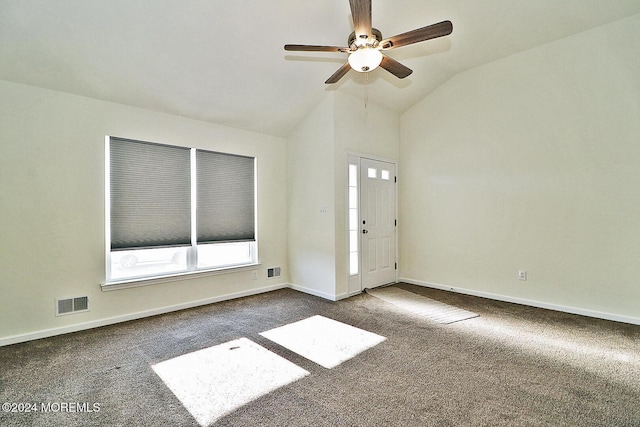 spare room with carpet flooring, ceiling fan, and lofted ceiling