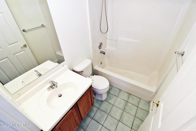 full bathroom featuring tile patterned floors, bathing tub / shower combination, vanity, and toilet