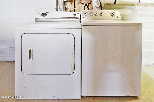 laundry area featuring washing machine and clothes dryer