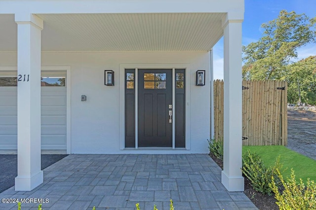 doorway to property featuring covered porch