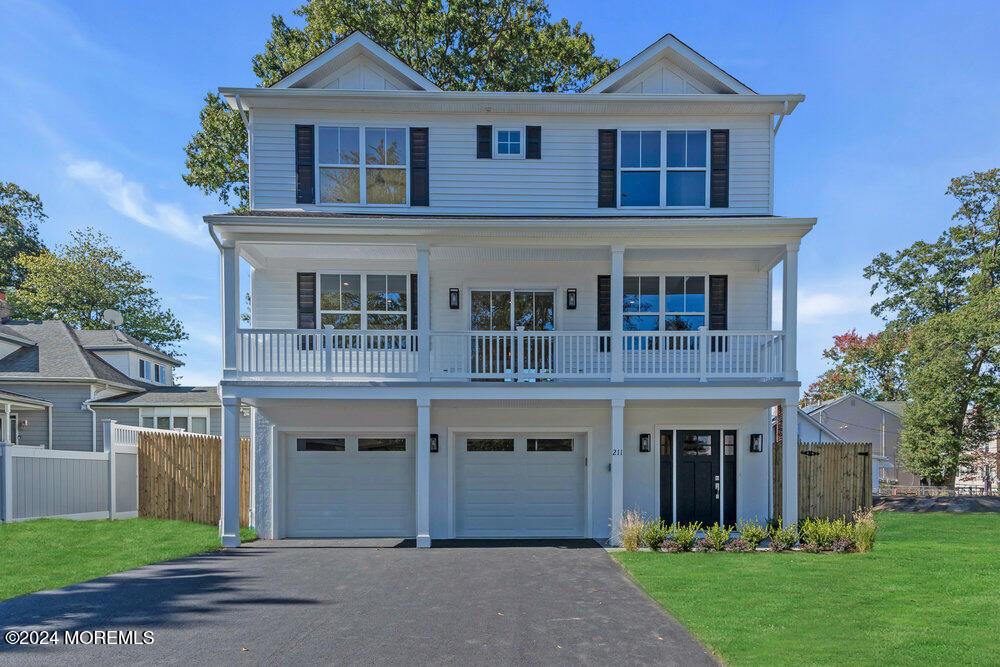 front facade with a front lawn and a garage