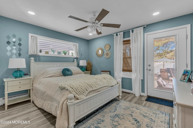 bedroom featuring access to outside, light hardwood / wood-style flooring, and ceiling fan