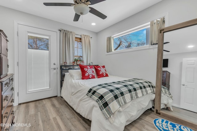 bedroom featuring ceiling fan and light hardwood / wood-style flooring